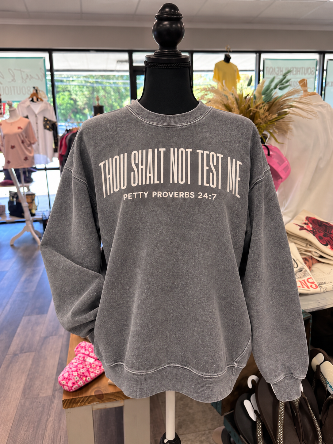 Gray Thou Shalt Not Test Me sweatshirt on boutique mannequin