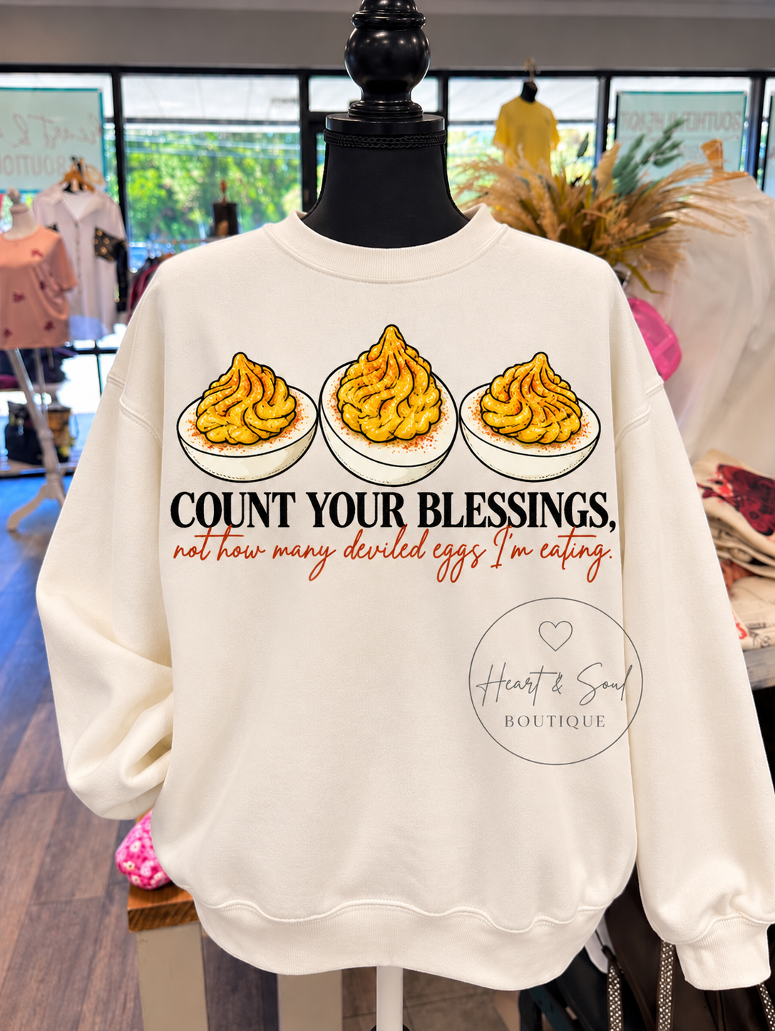 Cream Count Your Blessings deviled eggs sweatshirt on mannequin