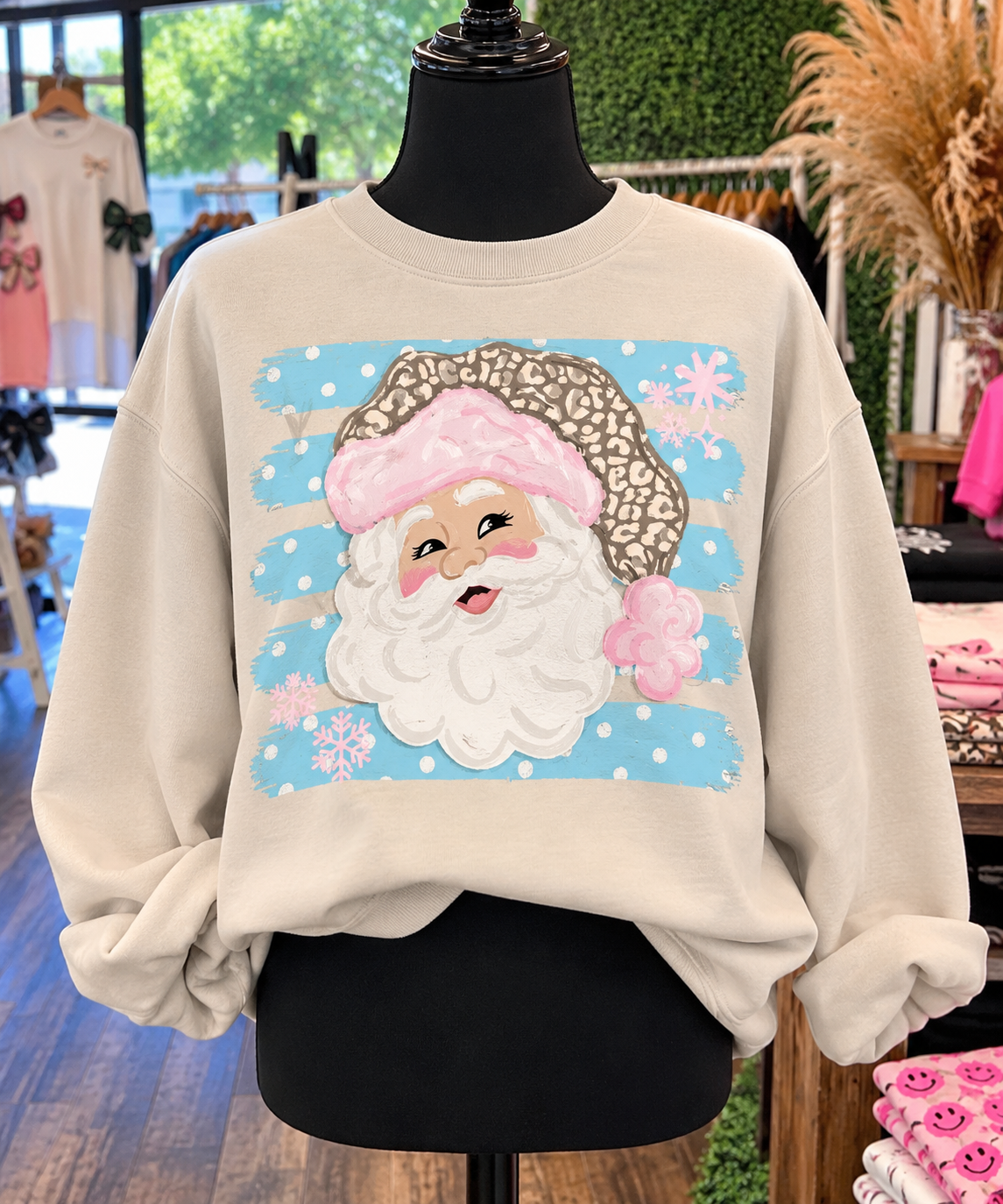 Pastel leopard Santa sweatshirt on boutique mannequin